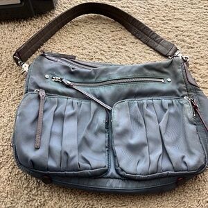 Vintage MZ Wallace large blue gray bag with leather strap.